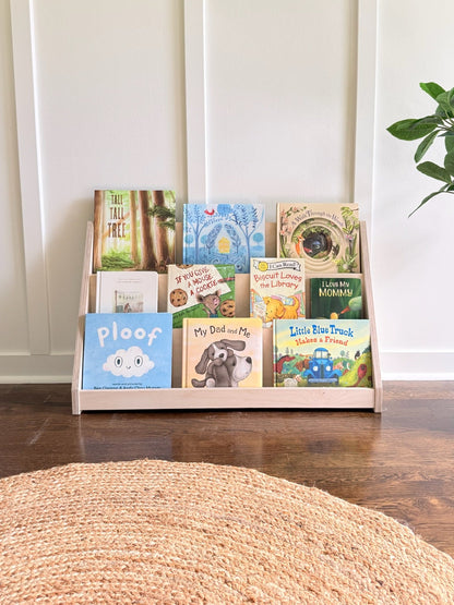Wooden bookshelf with children's books in bright room