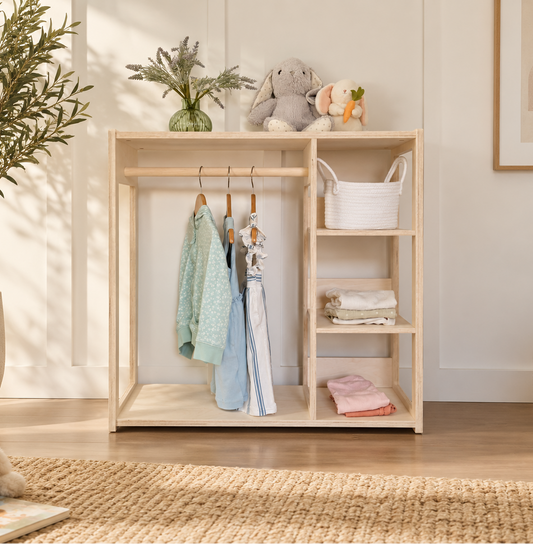 Birch children's wardrobe with clothing in a sunlight neutral room