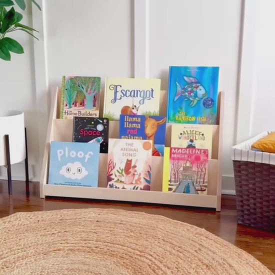 Video showing adult and child using small wooden bookshelf