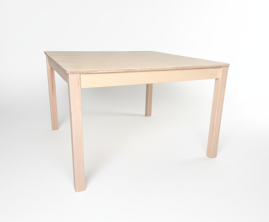 Plain montessori style birch childrens wooden table on a white background